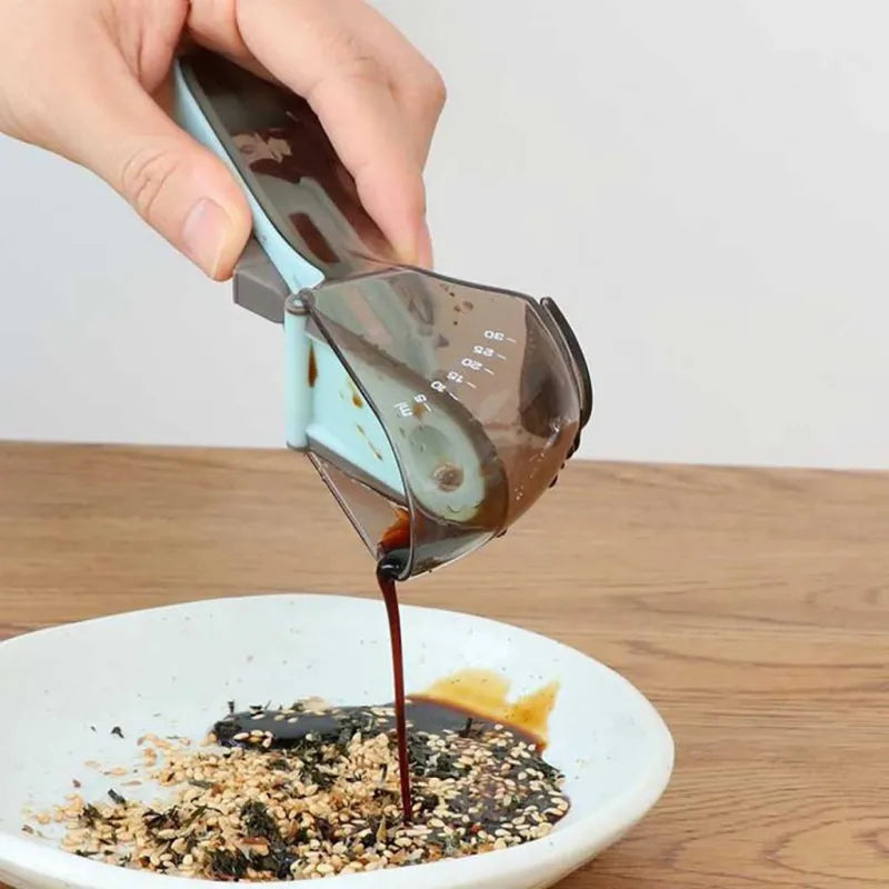 QuickMeasure Magnetic Measuring Set in use, showing pouring liquid ingredients into a bowl