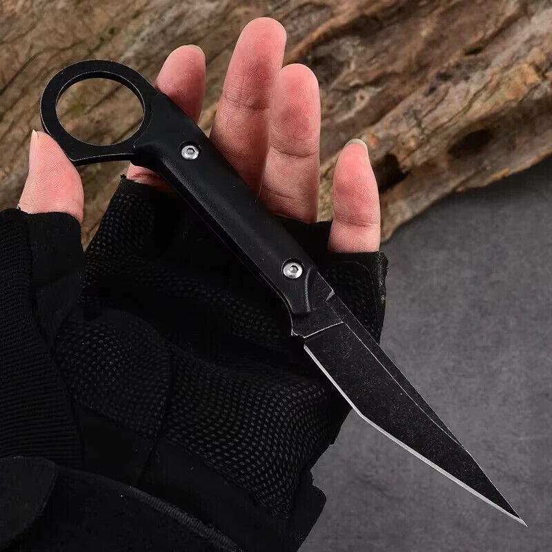 StealthEdge Tanto Neck Knife held in hand with black tactical glove