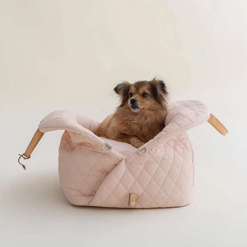 Small Dog in pink PlushPet Travel Tote - Safe, Comfortable, and Stylish Pet Carrier