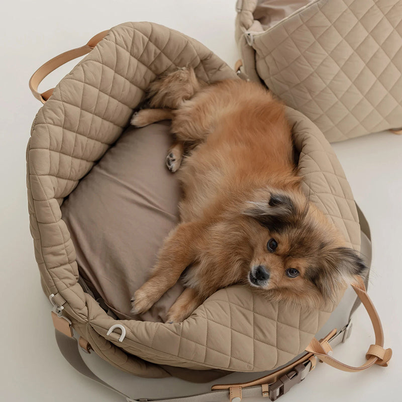 Small Dog lounging in PlushPet Travel Tote - Safe, Comfortable, and Stylish Pet Carrier