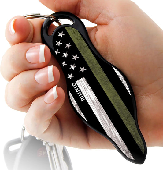 Ultimate Self Defense Keychain, thin green line, in hand