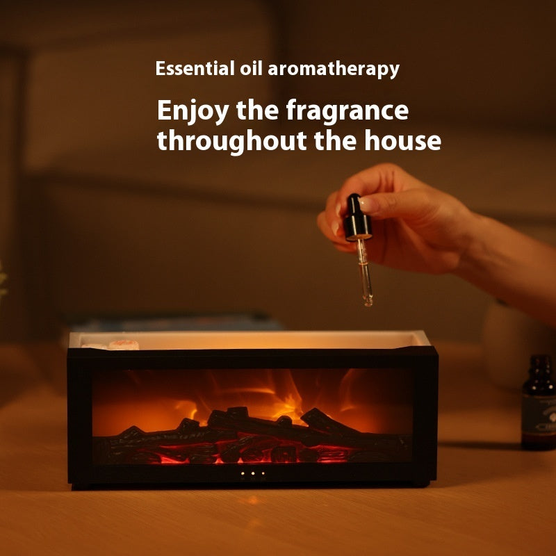 WarmGlow Mini Fireplace Diffuser adding essential oils for aromatherapy.